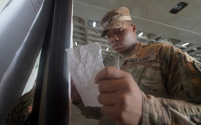 U.S. Army Spc. Takory Coleman, 149th Seaport Operations Company, 10th Transportation Battalion, 7th Transportation Brigade, records information during Exercise Dragon Lifeline July 31, 2018, at the Federal Law Enforcement Training Center in Charleston, S.C. The 841st Transportation Battalion hosted the exercise, facilitating training for Soldiers assigned to Fort Bragg, N.C., and Fort Eustis, Va. The exercise was designed to train participants in the planning and processes of rail, convoy, port and vessel operations.