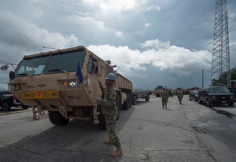 U.S. Army Soldiers, 149th Seaport Operations Company, 10th Transportation Battalion, 7th Transportation Brigade, move vehicles onto a vessel during Exercise Dragon Lifeline July 31, 2018, at the Federal Law Enforcement Training Center in Charleston, S.C.  The 841st Transportation Battalion hosted the exercise, facilitating training for Soldiers assigned to Fort Bragg, N.C., and Fort Eustis, Va. The exercise was designed to train participants in the planning and processes of rail, convoy, port and vessel operations.
