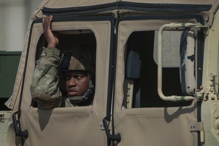 A U.S. Army Soldier looks out the window of a Humvee during rail operations as part of Exercise Dragon Lifeline Aug. 1, 2018, at Joint Base Charleston’s Naval Weapons Station, S.C. The 841st Transportation Battalion hosted the exercise, facilitating training for Soldiers assigned to Fort Bragg, N.C., and Fort Eustis, Va. The exercise was designed to train participants in the planning and processes of rail, convoy, port and vessel operations.