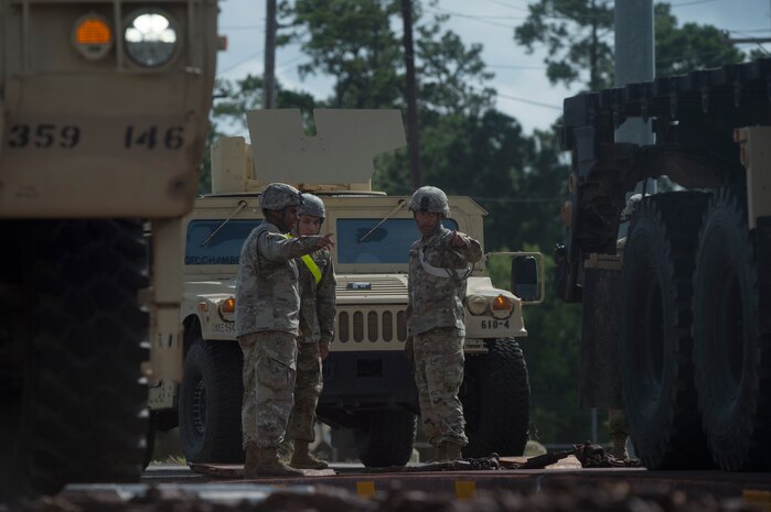 U.S. Army Soldiers prepare to move vehicles during rail operations as part of Exercise Dragon Lifeline Aug. 1, 2018, at Joint Base Charleston’s Naval Weapons Station, S.C. The 841st Transportation Battalion hosted the exercise, facilitating training for Soldiers assigned to Fort Bragg, N.C., and Fort Eustis, Va. The exercise was designed to train participants in the planning and processes of rail, convoy, port and vessel operations.