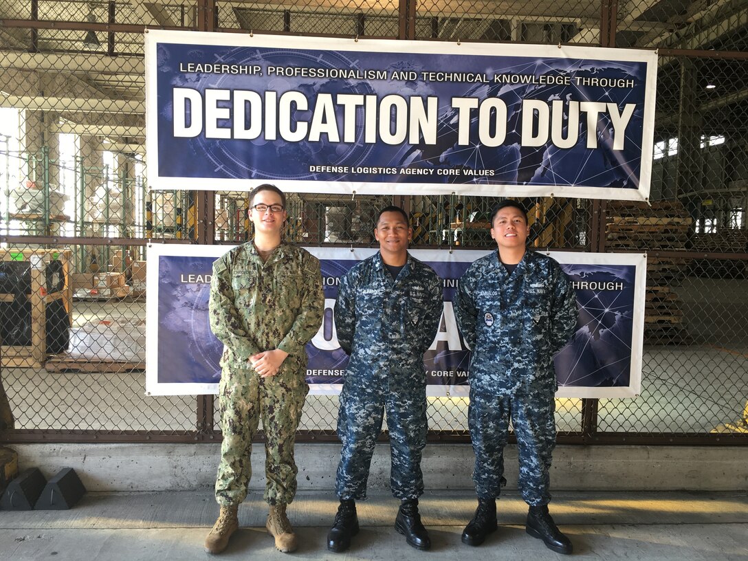 DLA Distribution Yokosuka, Japan at Sasebo sailors: (left to right) Navy Logistics Specialist Seaman Recruit Jonathan Schroeder, Logistics Specialist 1st Class Mark Alvaro and Logistics Specialist 2nd Class Enrito Jambalos volunteer time to USO Sasebo in support of their “Christmas in July” event for a local Japanese orphanage on July 14.