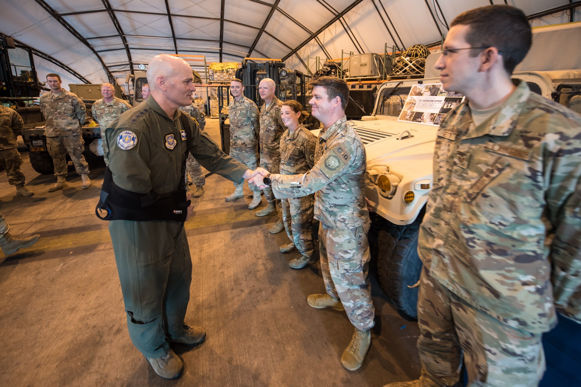The commander of Air Mobility Command, Gen. Carlton D. Everhart II (left), greets Tech. Sgt. Ryan McNary of the 123rd Contingency response Group during a tour of the Kentucky Air National Guard Base in Louisville, Ky., Aug. 3, 2018. The group played a key role in hurricane recovery operations last year. (U.S. Air National Guard photo by Master Sgt. Phil Speck)