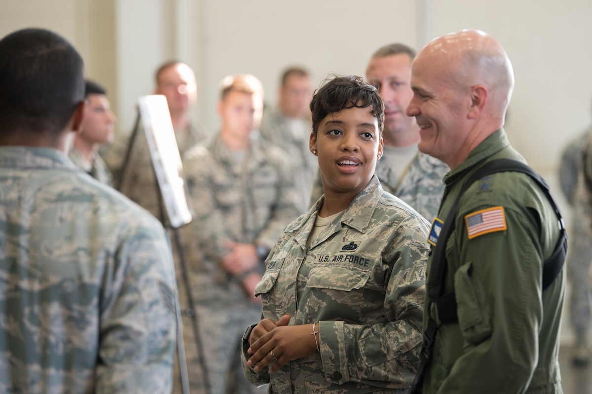 The commander of Air Mobility Command, Gen. Carlton D. Everhart II (right), receives a briefing from Master Sgt. Zakiya Taylor of the 123rd Force Support Squadron about the unit's support of hurricane response operations last year during a tour of the Kentucky Air National Guard Base in Louisville, Ky., Aug. 3, 2018. (U.S. Air National Guard photo by Master Sgt. Phil Speck)