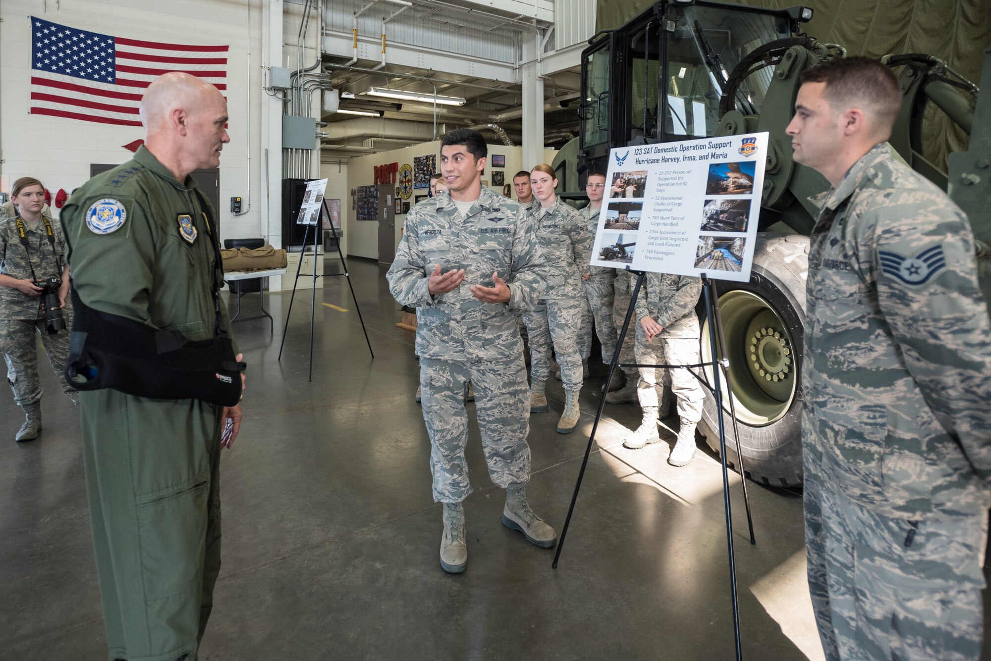 The commander of Air Mobility Command, Gen. Carlton D. Everhart II (left), receives a briefing on Small Air Terminal capabilities at the 123rd Airlift Wing from Staff Sgt. Joseph Mendoza during a tour of the Kentucky Air National Guard Base in Louisville, Ky., Aug. 3, 2018. The terminal played a key role in hurricane recovery efforts last year. (U.S. Air National Guard photo by Lt. Col. Dale Greer)