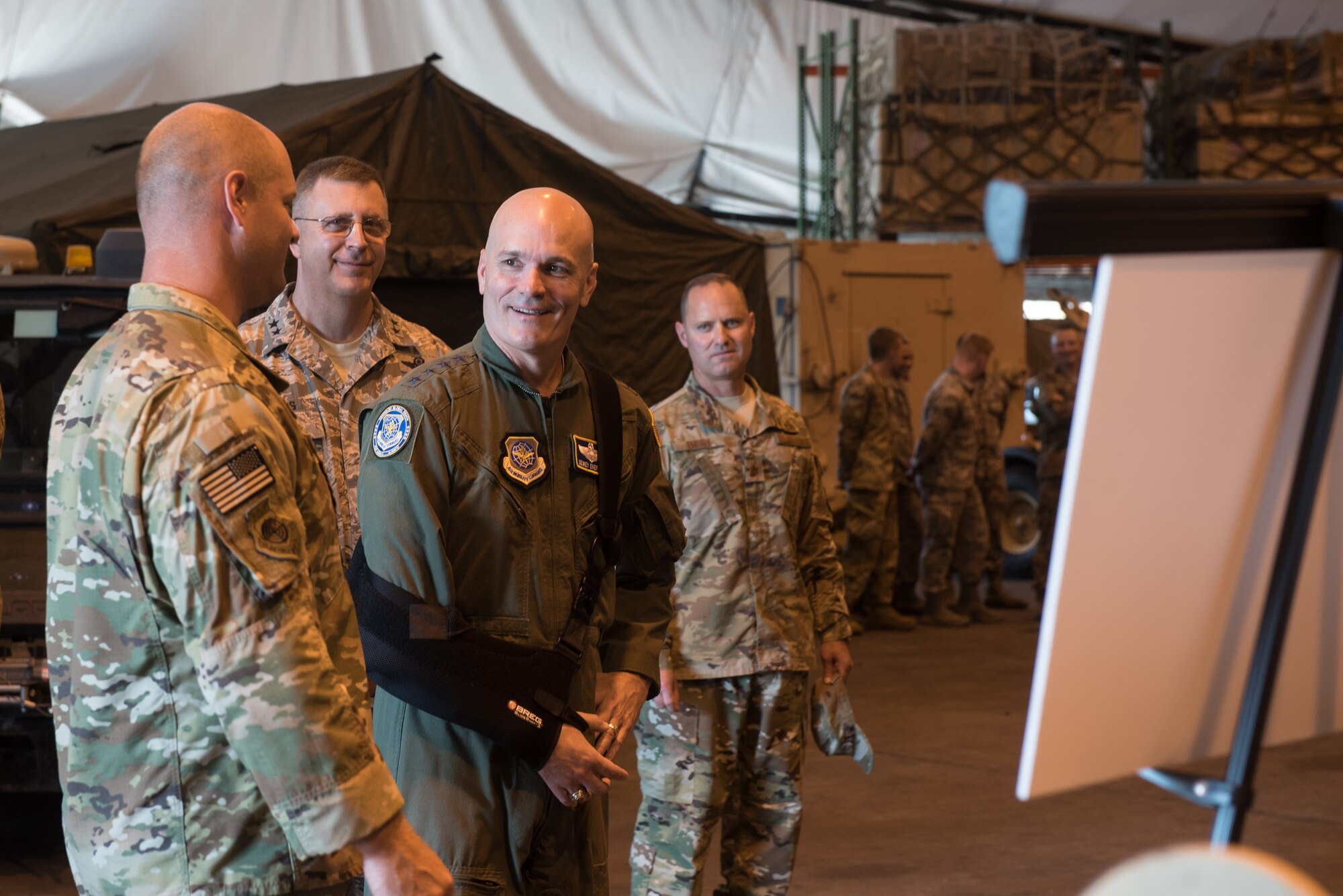 The commander of Air Mobility Command, Gen. Carlton D. Everhart II (second from right), speaks with Airmen from the 123rd Contingency Response Group during a tour of the Kentucky Air National Guard Base in Louisville, Ky., Aug. 3, 2018. The group was instrumental in hurricane recovery efforts last year. (U.S. Air National Guard photo by Airman Chloe Ochs)