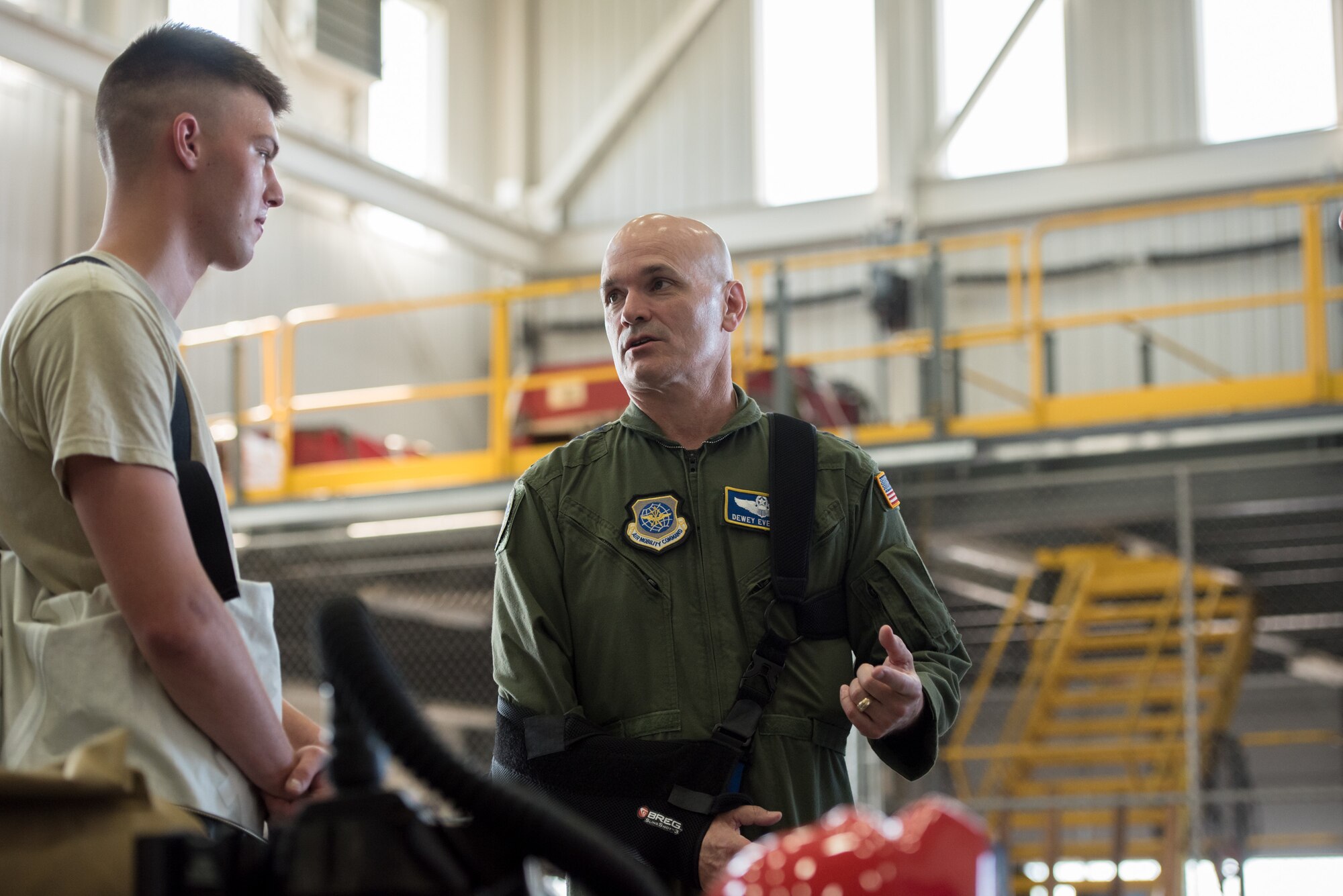 The commander of Air Mobility Command, Gen. Carlton D. Everhart II (right), speaks with Senior Airman William Helmick of the 123rd Airlift Wing's Fatality Search and Recovery Team during a tour of the Kentucky Air National Guard Base in Louisville, Ky., Aug. 3, 2018. The wing is home to 1,200 Airmen and eight C-130H Hercules aircraft. (U.S. Air National Guard photo by Airman Chloe Ochs)