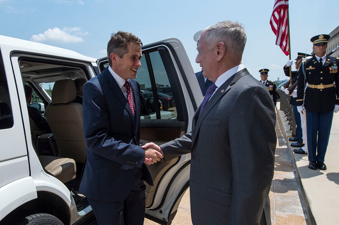 Defense Secretary James N. Mattis greets British Defense Secretary Gavin Williamson at the Pentagon.