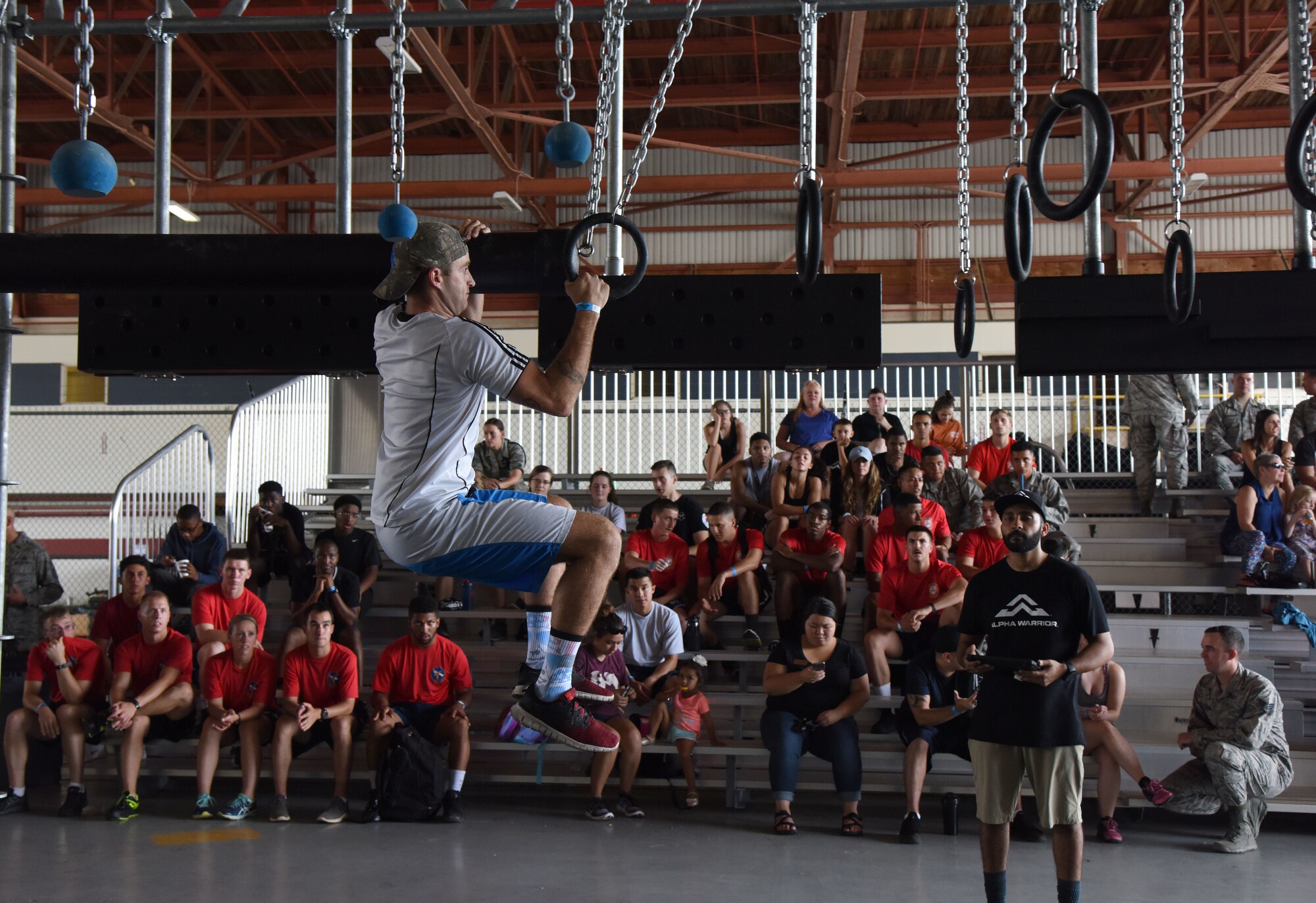 U.S. Air Force Tech. Sgt. Mitchell Beckner, 335th Training Squadron instructor, participates in the Alpha Warrior battle rig competition inside Hangar Four on Keesler Air Force Base, Mississippi, Aug. 3, 2018. Beckner joined over 100 Airmen in the competition hosted by the 81st Force Support Squadron and the Air Force Services Activity which promoted physical training. (U.S. Air Force photo by Kemberly Groue)