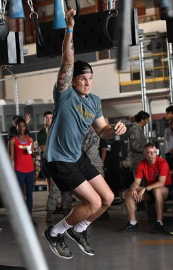 U.S. Air Force Tech. Sgt. Turner Phillips, 81st Training Support Squadron military training leader instructor, participates in the Alpha Warrior battle rig competition inside Hangar Four on Keesler Air Force Base, Mississippi, Aug. 3, 2018. Phillips joined over 100 Airmen in the competition hosted by the 81st Force Support Squadron and the Air Force Services Activity which promoted physical training. (U.S. Air Force photo by Kemberly Groue)