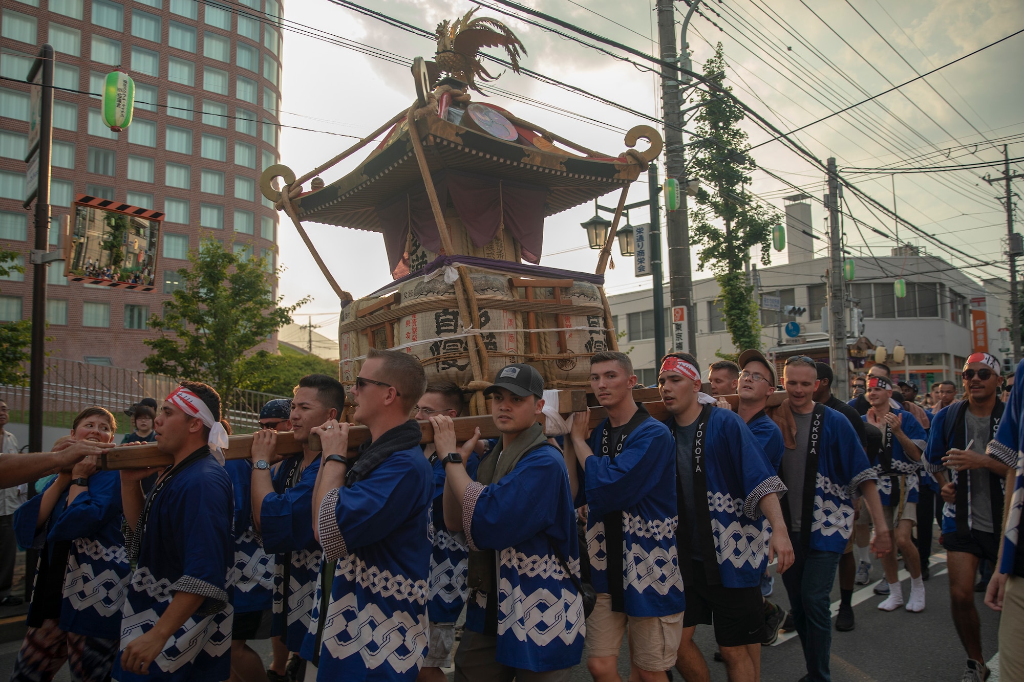 Members from Yokota Air Base carry the 374th Airlift Wing's official mikoshi during the 68th Annual Fussa Tanabata Festival at Fussa City,