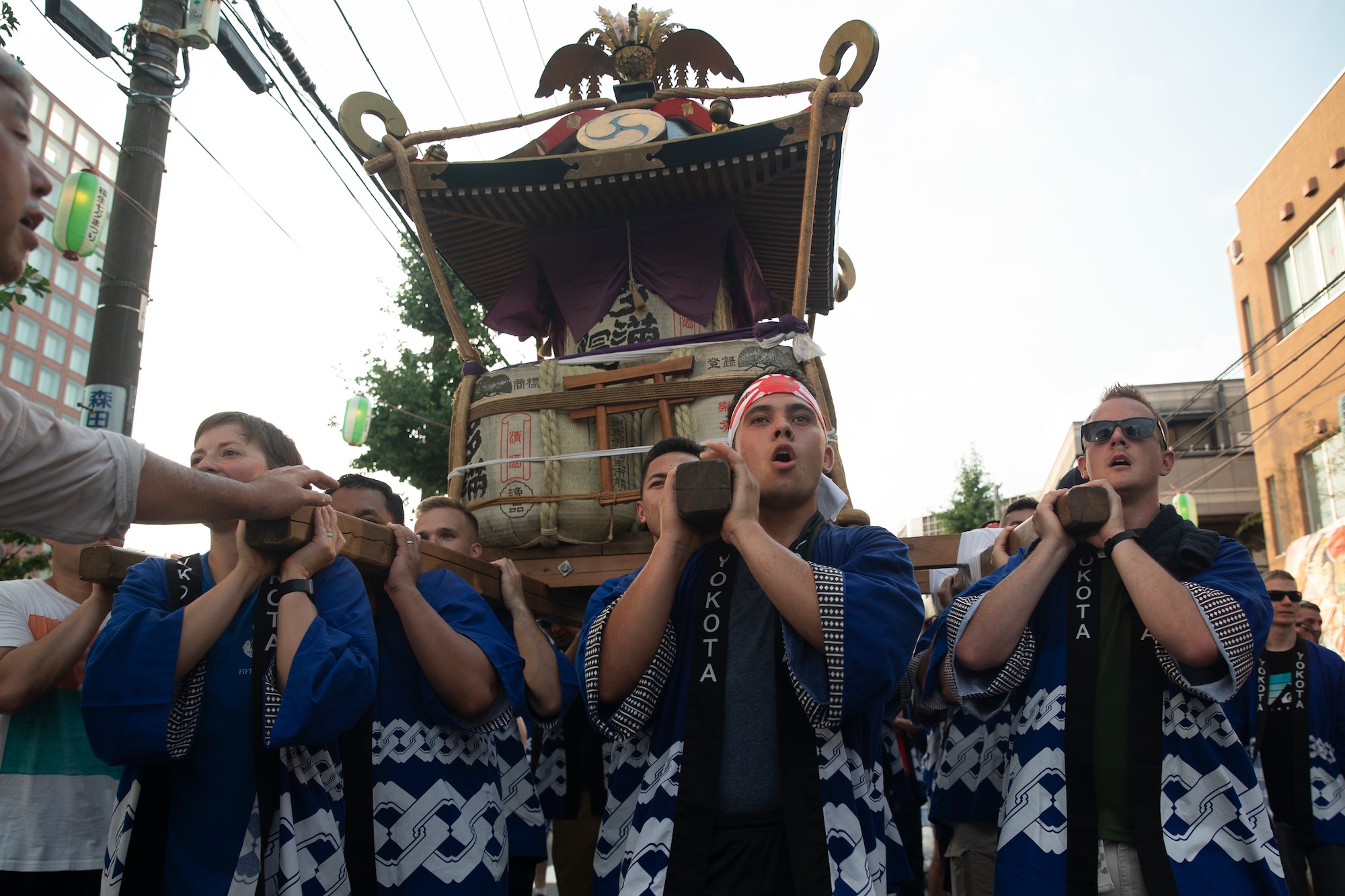 Members from Yokota Air Base carry the 374th Airlift Wing's official mikoshi during the 68th Annual Fussa Tanabata Festival at Fussa City