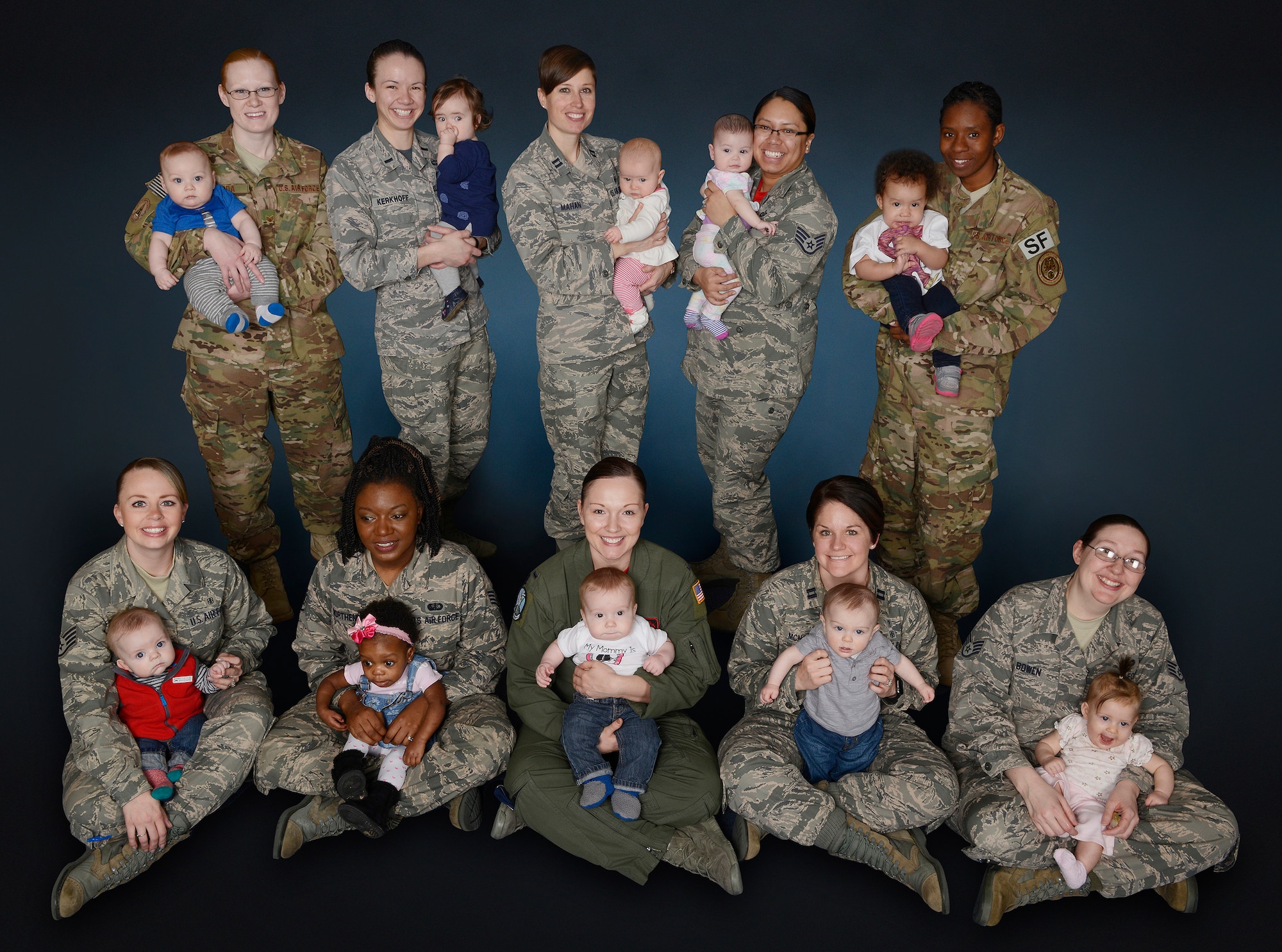 A group of 10 mothers represent a portion of women serving in the U.S. Air Force while breast-feeding their child. August is recognized as National Breast-feeding Month. (U.S. Air Force photo by Beau Wade)