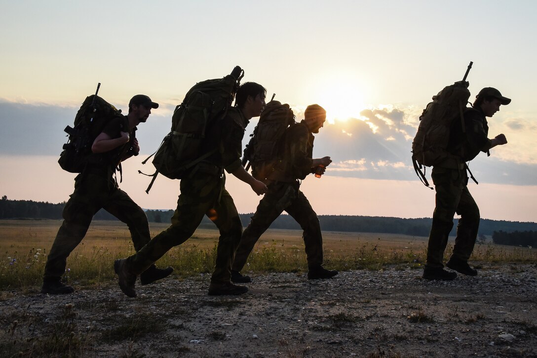 NATO sniper teams participate in the ruck march.
