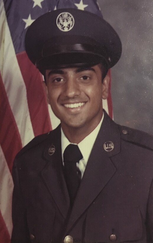 An airman poses for an official photo.