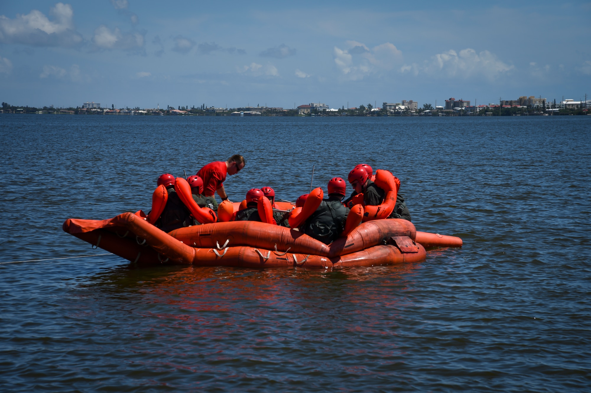 Aircrew from the 39th Rescue Squadron board a life raft Aug. 4, 2018, during water survival training at Patrick Air Force Base, Florida.