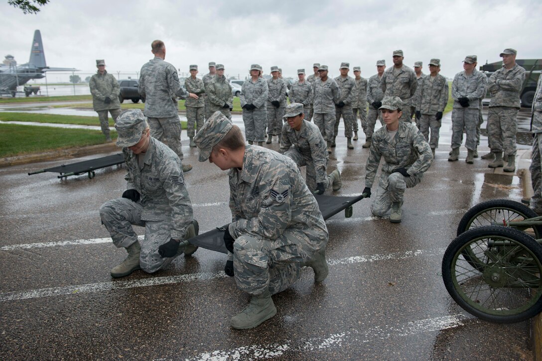 Members of the 934th Aeromdical Staging Squadron train to transport medical patients on litters during the August UTA. (Air Force Photo/Tech. Sgt. Amber E.N. Jacobs)