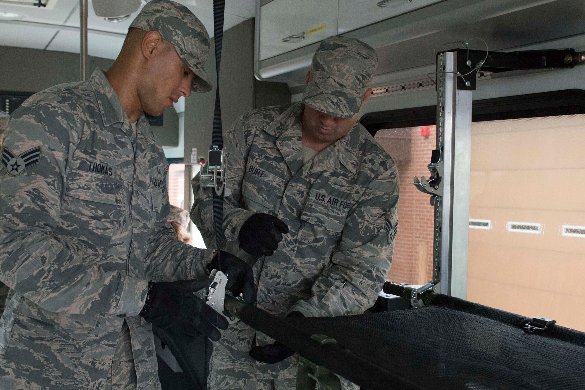 Members of the 934th Aeromdical Staging Squadron train to transport medical patients on litters during the August UTA. (Air Force Photo/Tech. Sgt. Amber E.N. Jacobs)
