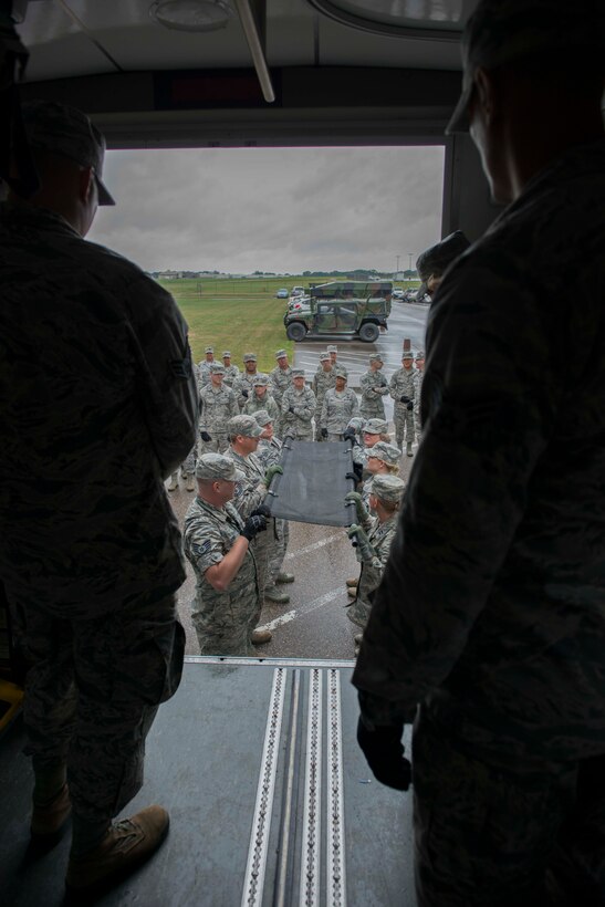 Members of the 934th Aeromdical Staging Squadron train to transport medical patients on litters during the August UTA. (Air Force Photo/Tech. Sgt. Amber E.N. Jacobs)