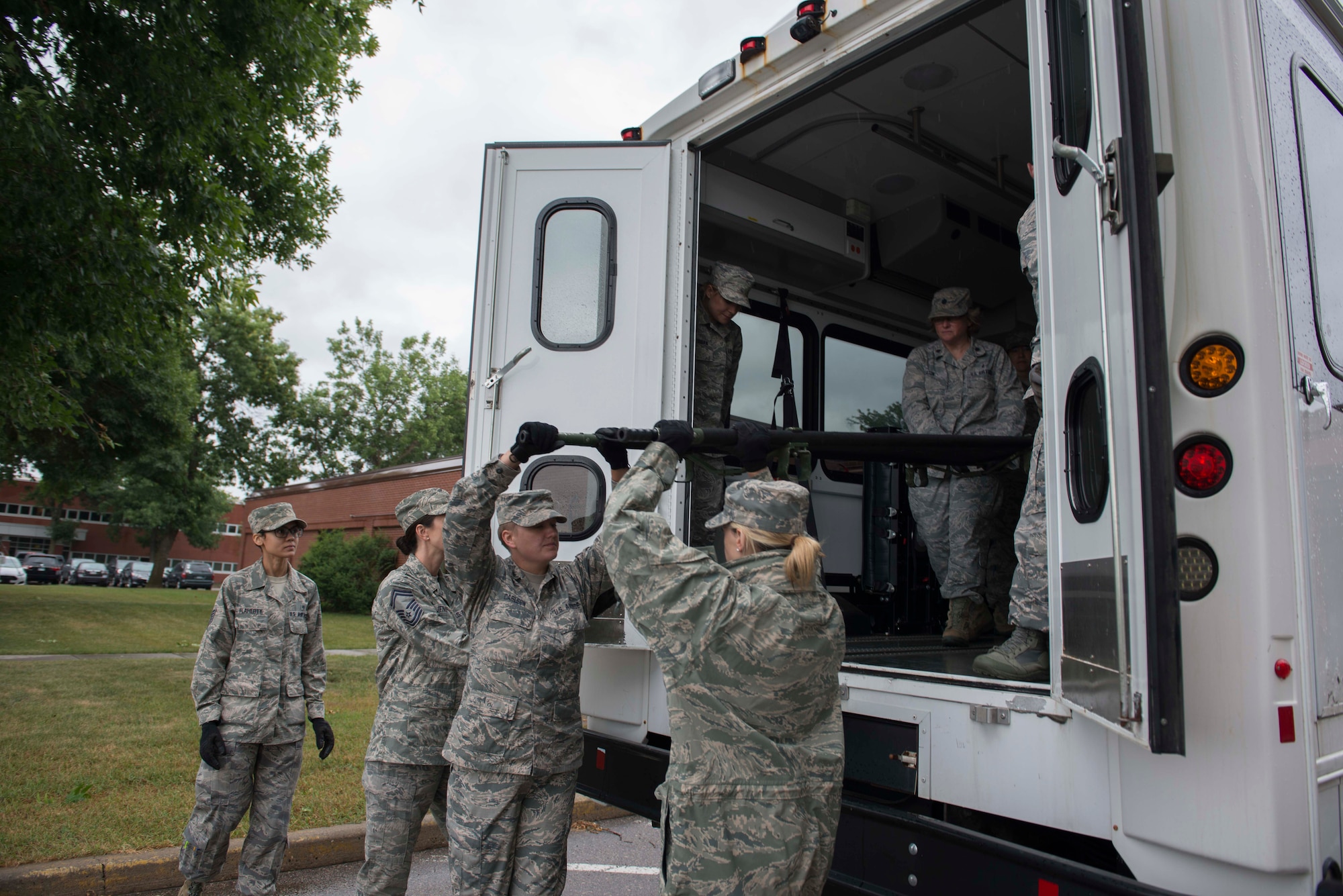 Members of the 934th Aeromdical Staging Squadron train to transport medical patients on litters during the August UTA. (Air Force Photo/Tech. Sgt. Amber E.N. Jacobs)