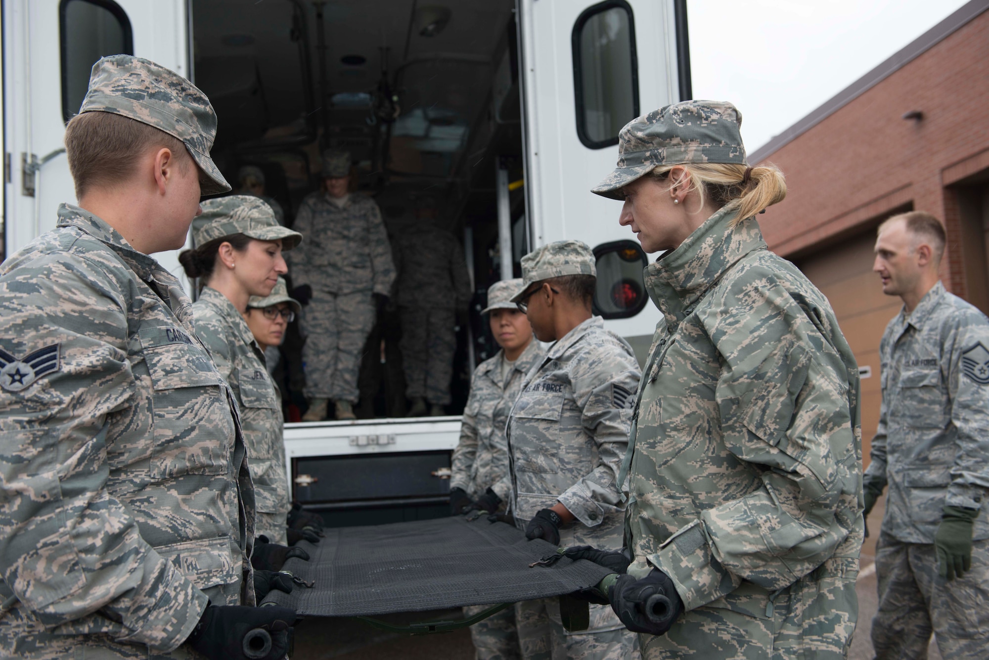 Members of the 934th Aeromdical Staging Squadron train to transport medical patients on litters during the August UTA. (Air Force Photo/Tech. Sgt. Amber E.N. Jacobs)