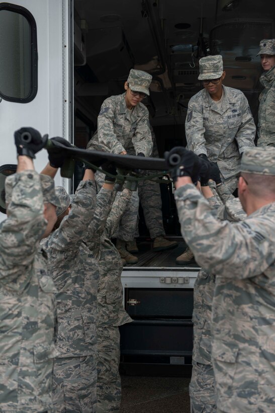 Members of the 934th Aeromdical Staging Squadron train to transport medical patients on litters during the August UTA. (Air Force Photo/Tech. Sgt. Amber E.N. Jacobs)