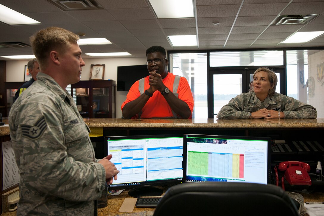 Col. Jennifer Short, right, 23d Wing commander, talks with Staff Sgt. Caleb Johnson, 23d Operations Support Squadron (OSS) airfield manager, during an immersion, Aug. 6, 2018, at Moody Air Force Base, Ga. Wing leadership toured the 23d OSS to meet with Airmen and learn about the day-to-day operations and emergency weather procedures.  Throughout their visit, Airmen shared with leadership their opinions and ideas for the continued success and improvement of the 23d OSS. (U.S. Air Force photo by Airman Taryn Butler)