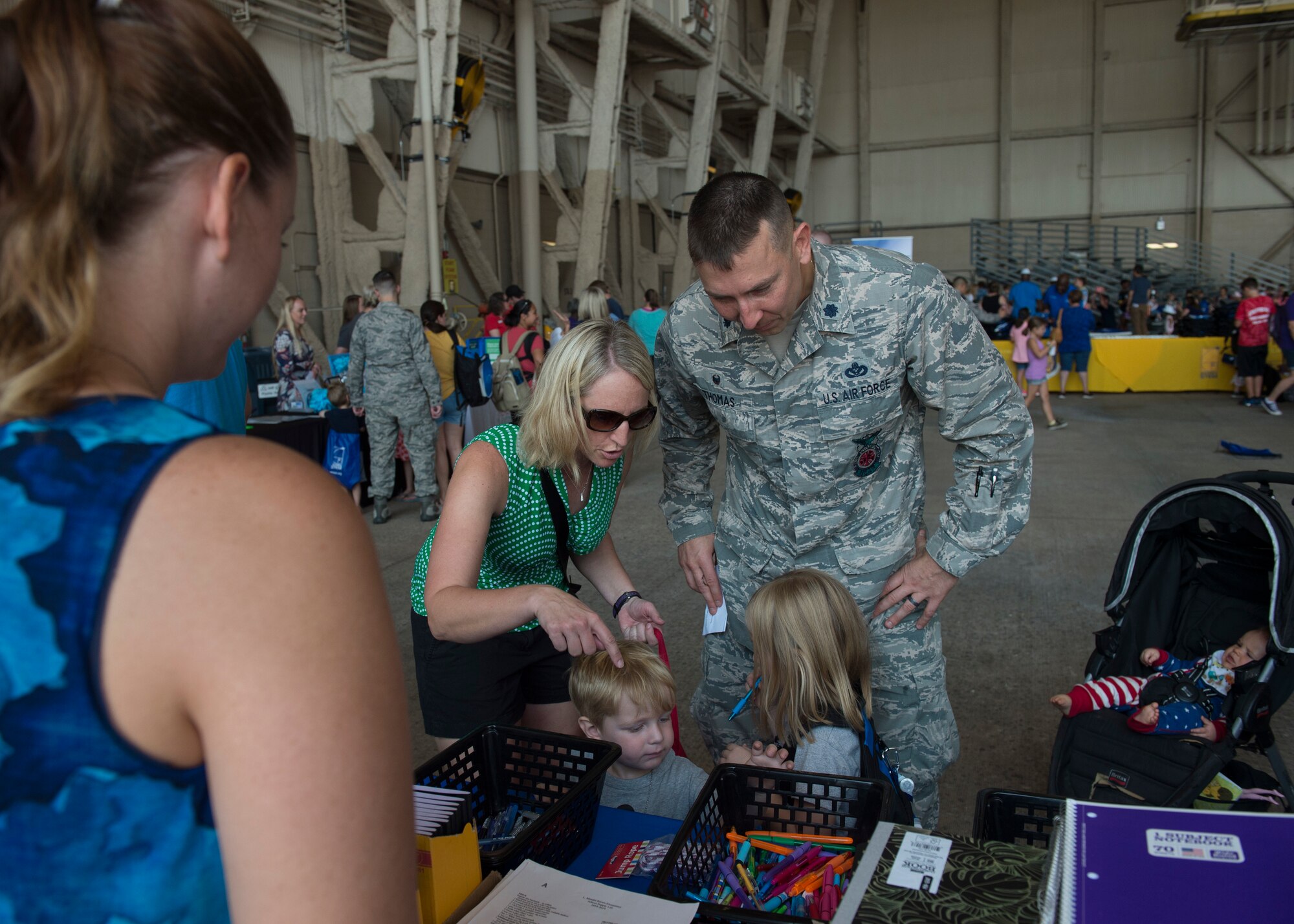 U.S. Air Force Lt. Col. Steven Thomas, a commander assigned to the 97th Civil Engineering Squadron, shops for school supplies with his family during the Kids Deployment Line, August 2, 2018, at Altus Air Force Base, Okla.