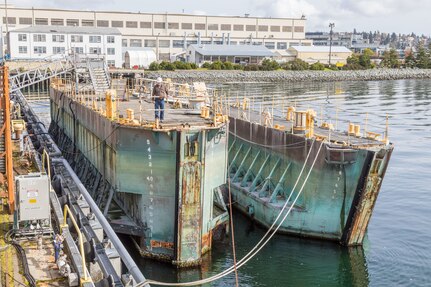 Historic caissons 2 and 3 at Puget Sound Naval Shipyard & Intermediate Maintenance Facility in Bremerton, Wash., in 2018. Two caissons are currently being offered for sale through the Defense Logistics Agency's disposition services.