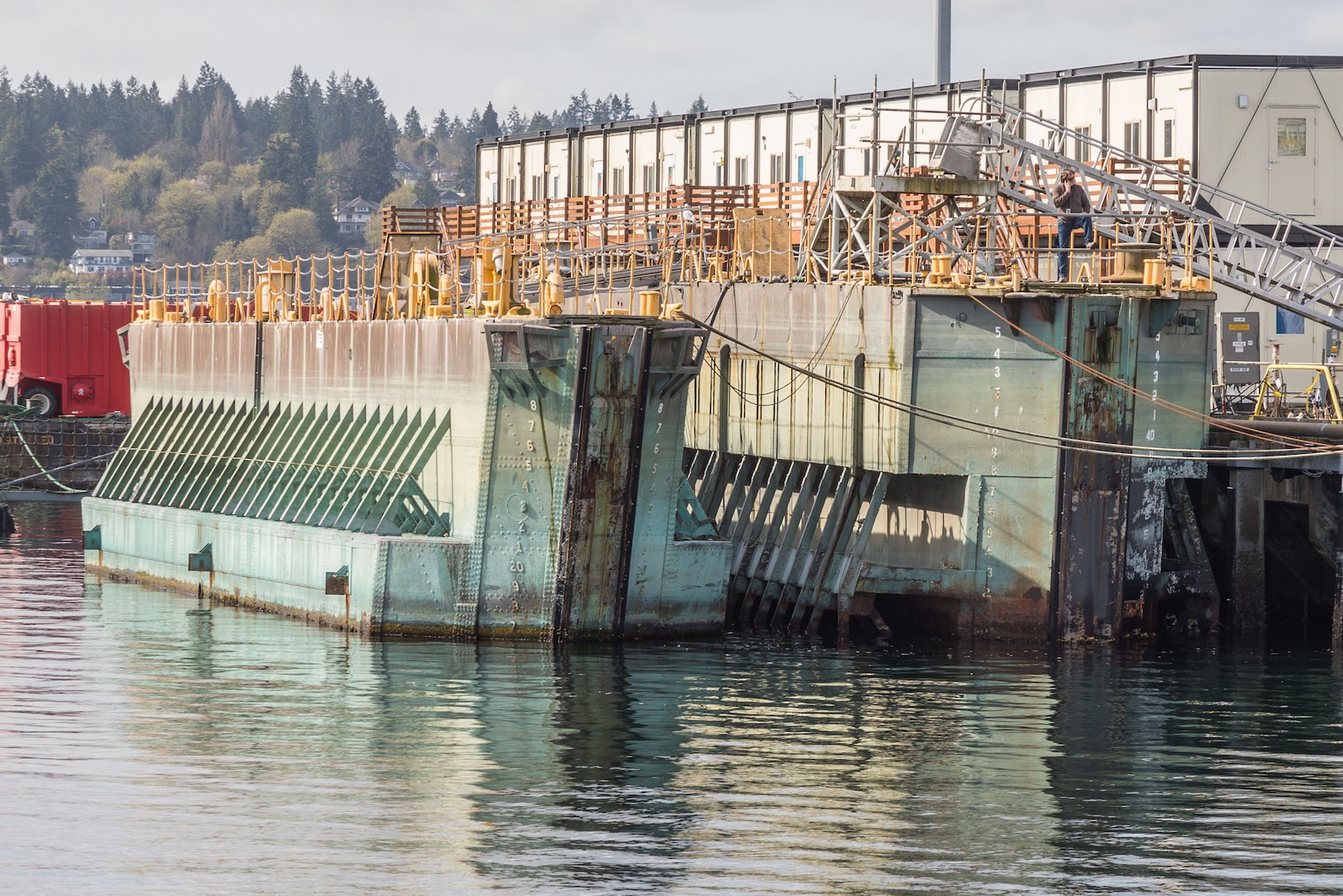 Historic caissons 2 and 3 seen at Puget Sound Naval Shipyard & Intermediate Maintenance Facility in Bremerton, Wash., in 2018. The watercraft are currently being offered for sale through the Defense Logistics Agency's disposition services.