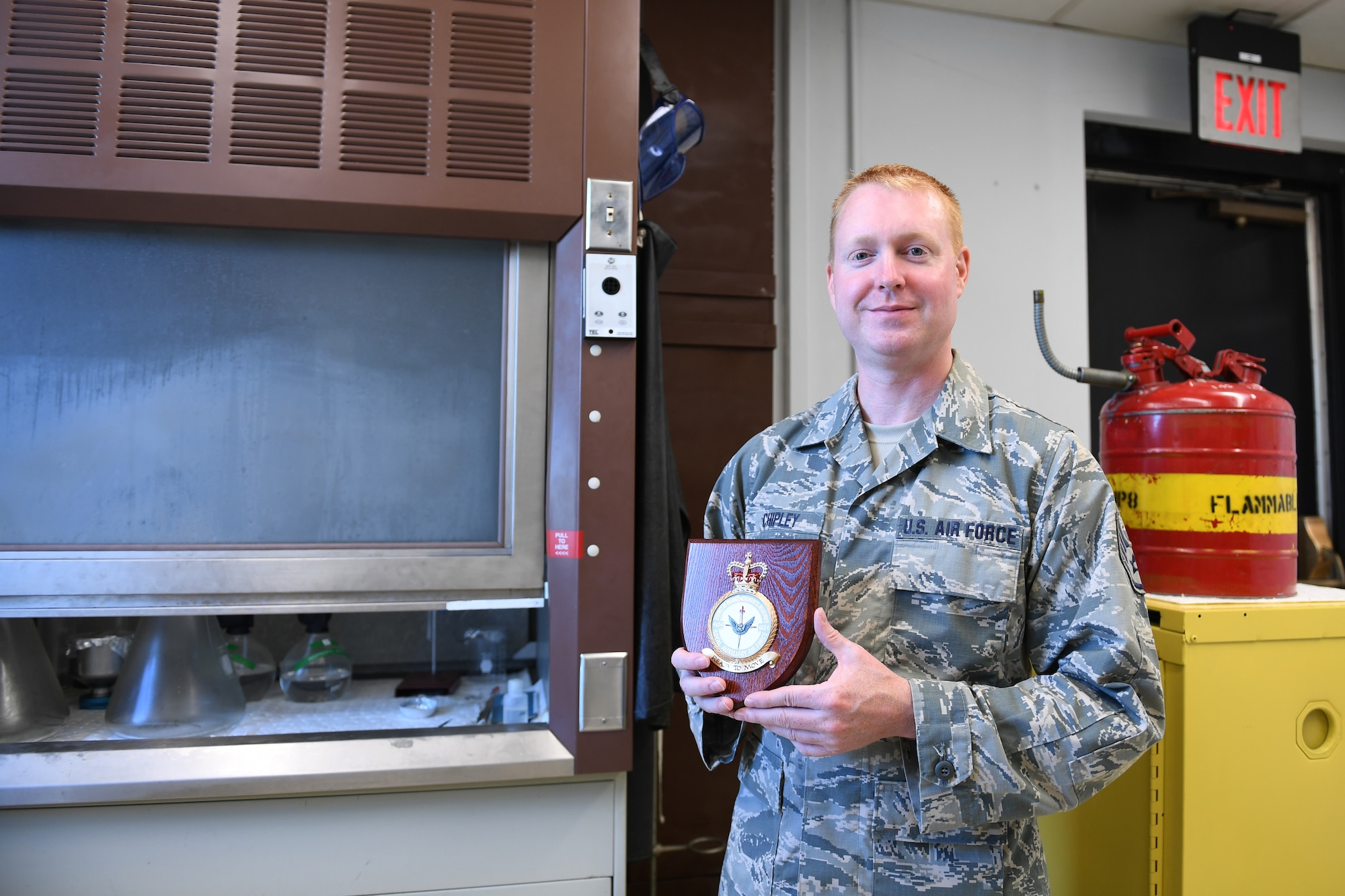 U.S. Air Force Staff Sgt. Jason Chipley, 145th Logistics Readiness Squadron, posed with a squadron plaque that he received from spending two weeks with the Royal Air Force in the United Kingdom as part of the Military Reserve Exchange Program at the North Carolina Air National Guard Base, Charlotte Douglas International Airport, August 5, 2018. During his trip, Chipley was embedded with members of the 4624 Squadron of the Royal Air Force where he presented briefings about the North Carolina Air National Guard and experienced their military culture.