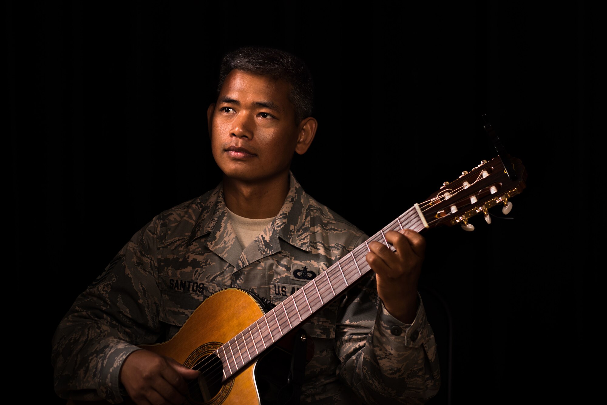 U.S. Air Force Tech. Sgt. Daniel Santos, U.S. Air Force Heritage Band of America guitarist, poses for a photo at Joint Base Langley-Eustis, Virginia, Aug. 1, 2018.