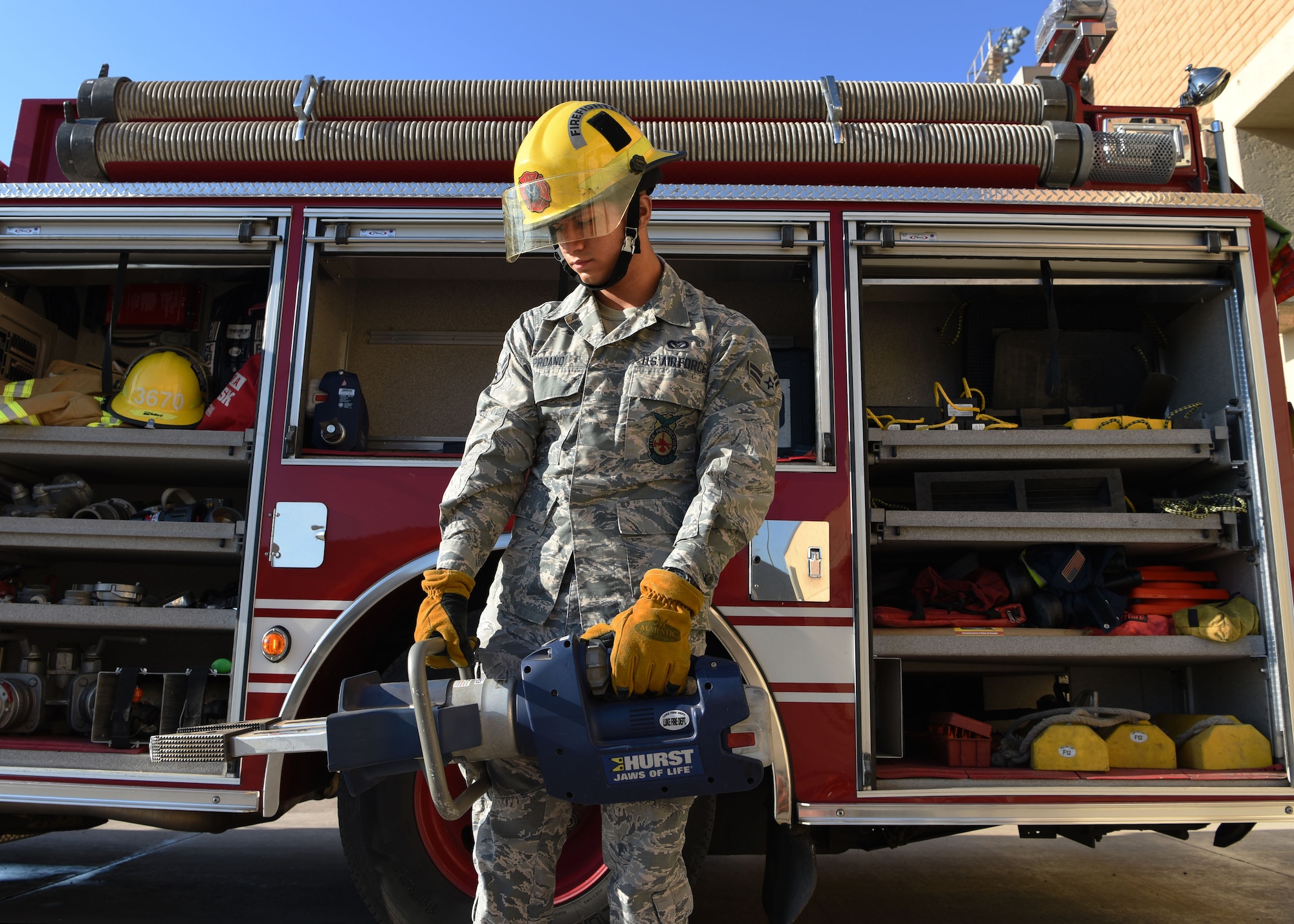 Airman 1st Class Damian Proano, 56th Civil Engineer Squadron firefighter, tests equipment on a fire engine Aug. 6, 2018, at Luke Air Force Base, Ariz.