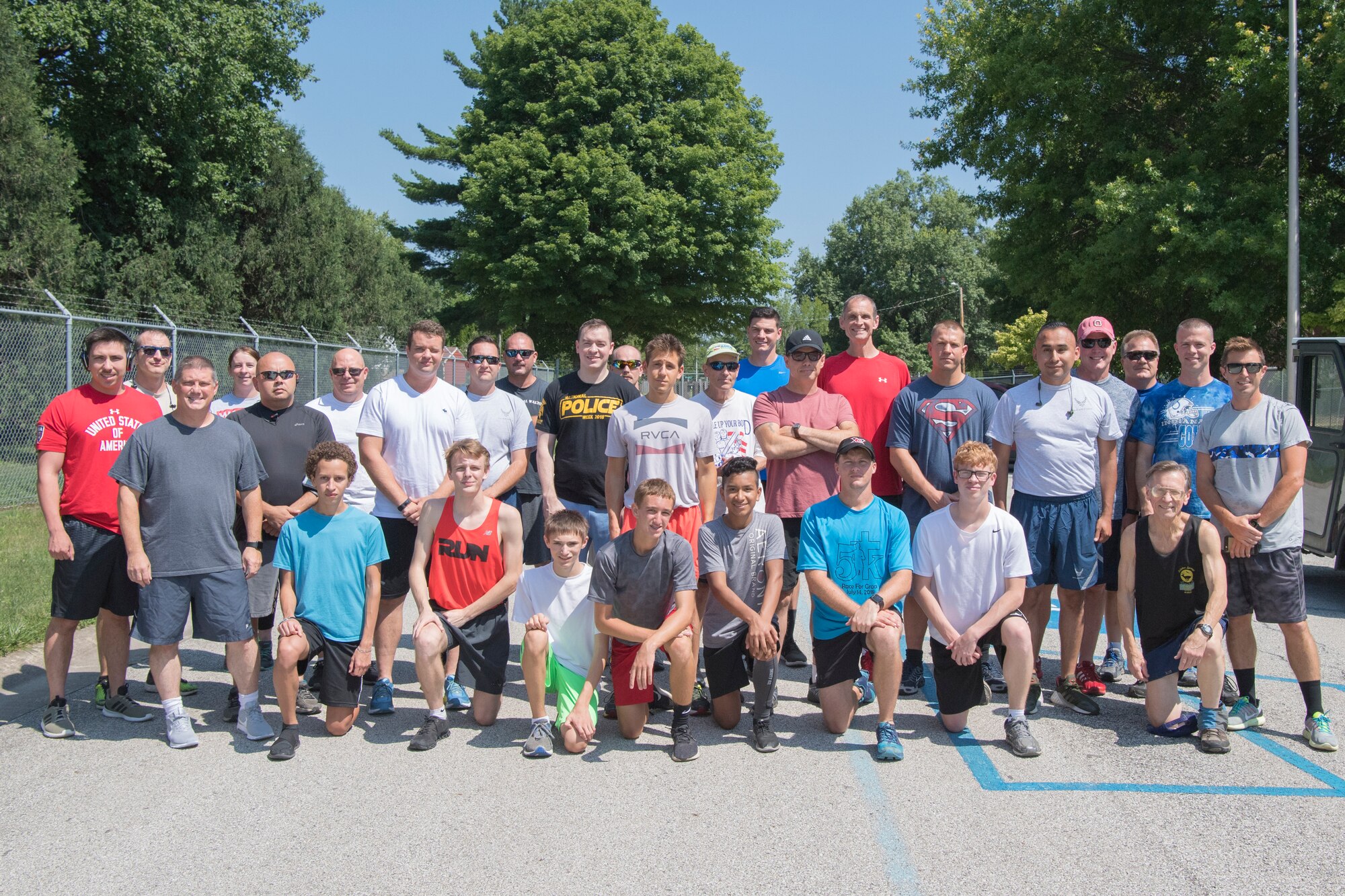 Runners from Grissom’s Dog Days of Summer 5k pose for a photo at Grissom Air Reserve Base, Ind., July 25, 2018. Grissom holds a variety of runs throughout the year with the next being scheduled Aug. 29, 2018. (U.S. photo by Tech. Sgt. Benjamin Mota)