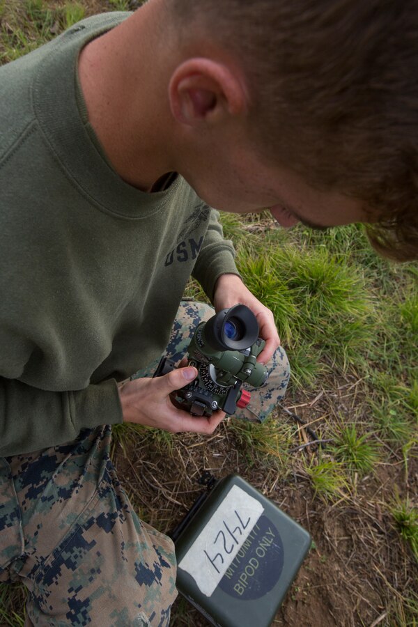 Lance Cpl. Vince Walls, a mortarman with Lima Company, 3rd Battalion, 25th Marine Regiment, inspects a mortar sight during Exercise Northern Strike at Camp Grayling, Mich., Aug. 7, 2018. Exercise Northern Strike is a National Guard Bureau-sponsored training exercise that unites service members from multiple branches, states and coalition countries to conduct combined ground and air combat operations. (U.S. Marine Corps photo by Cpl. Niles Lee)