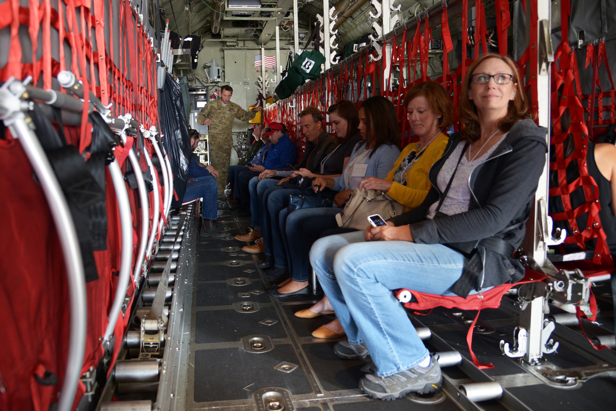 Civilian employers take their seats aboard a C-130 Hercules aircraft and await  takeoff  Aug. 3, 2018, at Peterson Air Force Base, Colorado. Employers of Air Force reservists were invited to attend Employer Appreciation Day to get a snapshot of the  reserve mission at the 302nd Airlift Wing,  Peterson AFB. (U.S. Air Force photo by Staff Sgt. Justin R. Norton)
