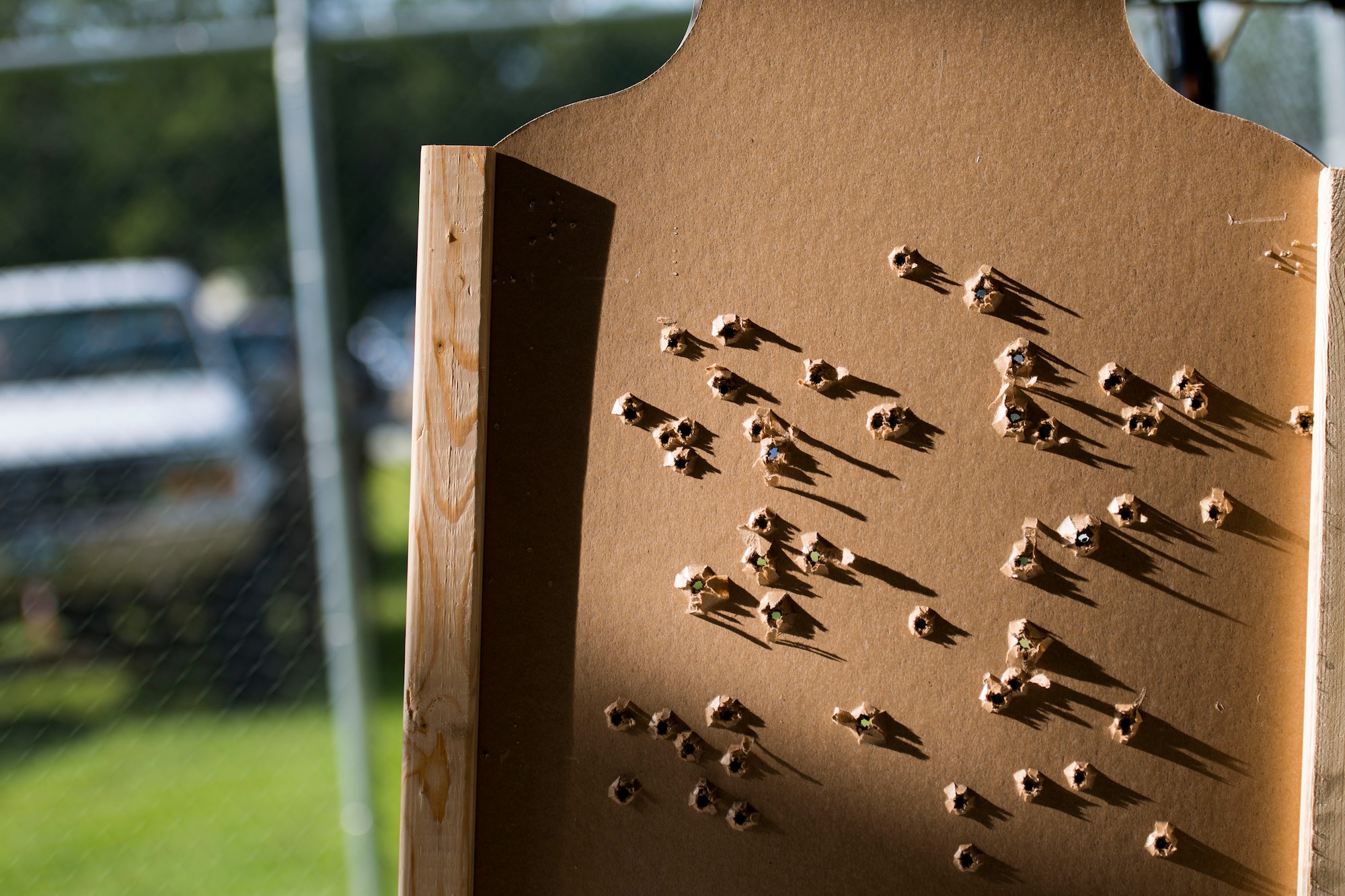 A bullet-riddled target rests after the shooting competition portion of the Defender Challenge assessment, July 30, 2018, at Moody Air Force Base, Ga. Seven Moody defenders trudged through a gauntlet that tested their capability, lethality and readiness. Ultimately, only Senior Airman Jeffrey Lewis, 822d Base Defense Squadron fireteam leader, had the scores, determination and perseverance to advance to the next level for a chance to represent Air Combat Command during the 2018 Defender Challenge, Sept. 8-14, at Joint Base San Antonio-Camp Bullis, Texas. (U.S. Air Force photo by Airman 1st Class Erick Requadt)