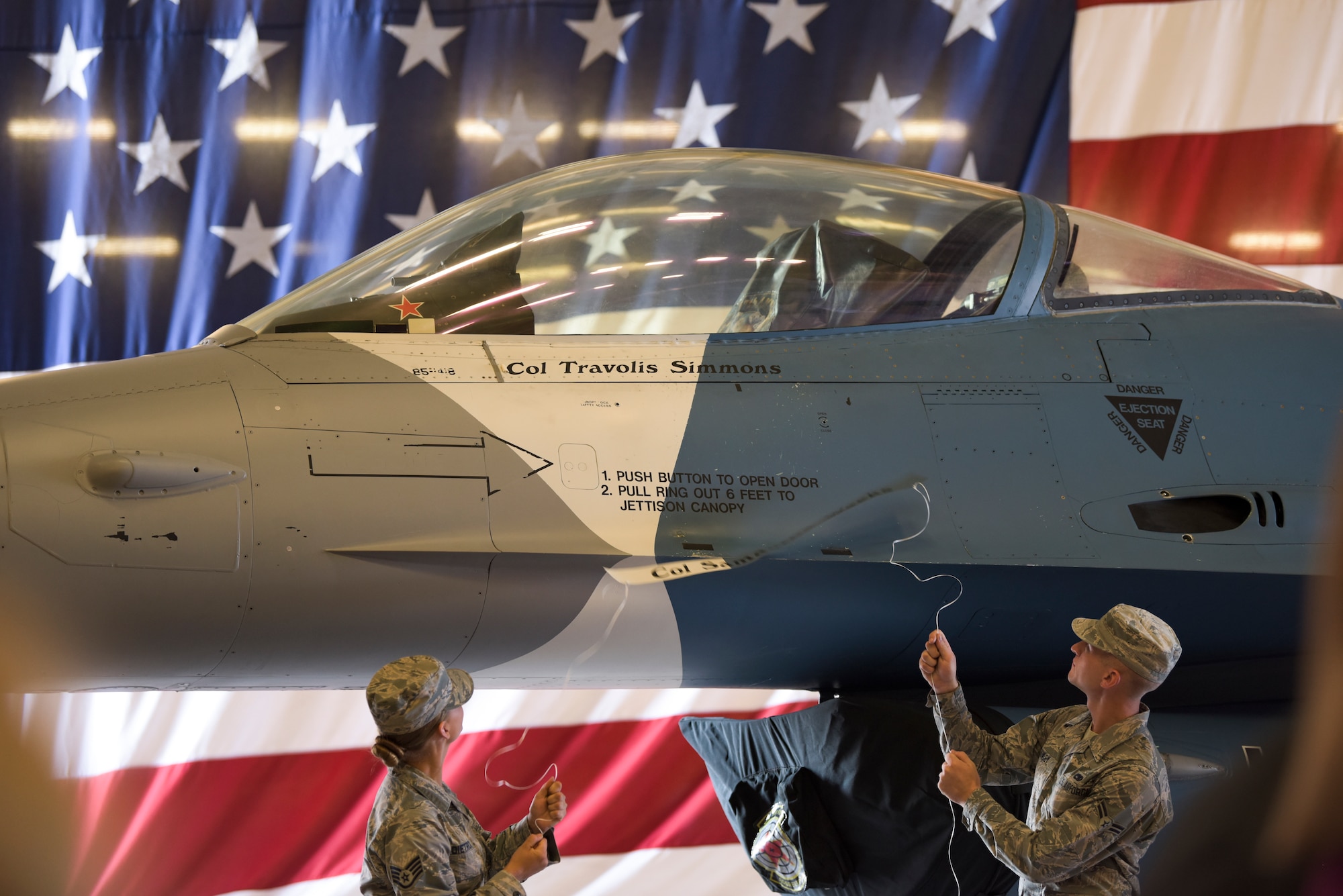 Airmen assigned to the 57th Aircraft Maintenance Squadron Viper Aircraft Maintenance Unit reveal the 57th Adversary Tactics Group incoming commander’s name during a change of command ceremony at Nellis Air Force Base, Nevada, Aug. 8, 2018. The 57th ATG boasts the world’s most capable and professional aggressor force to train US personnel and coalition partners during exercises and deployments. (U.S. Air Force photo by Airman 1st Class Andrew D. Sarver)