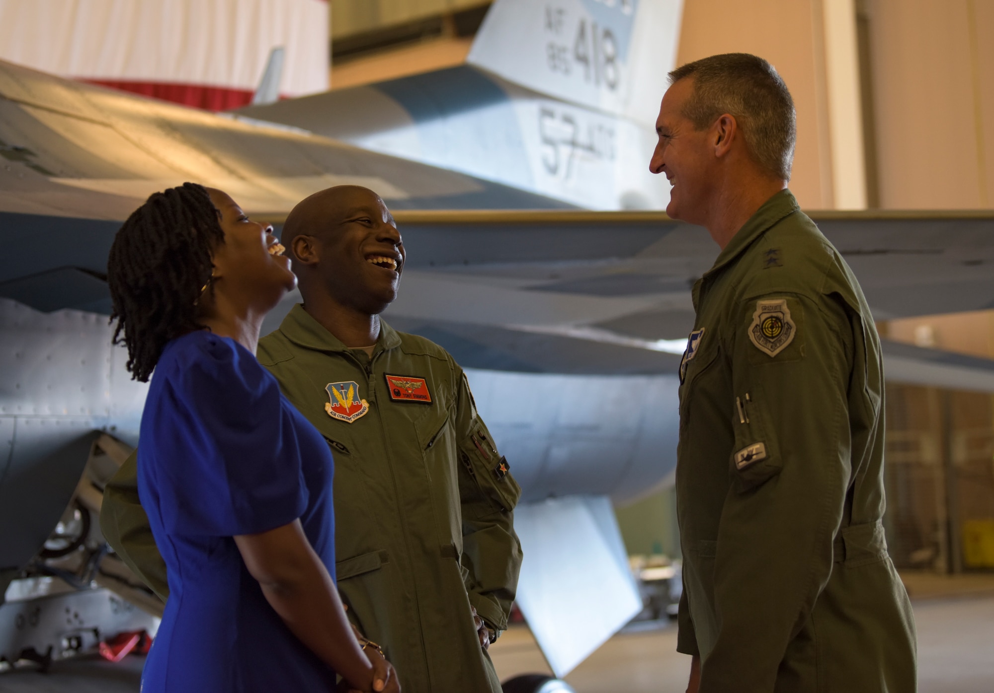 Maj. Gen. Peter Gersten, U.S. Air Force Warfare Center commander, greets Col. Travolis Simmons, 57th Advanced Tactics Group commander, and his wife, Mrs. Simmons, after a change of command ceremony at Nellis Air Force Base, Nevada, Aug. 8, 2018. The 57th ATG prepares the military to win our nation’s war by providing leaders who know, teach and replicate the enemy. (U.S. Air Force photo by Airman 1st Class Andrew D. Sarver)