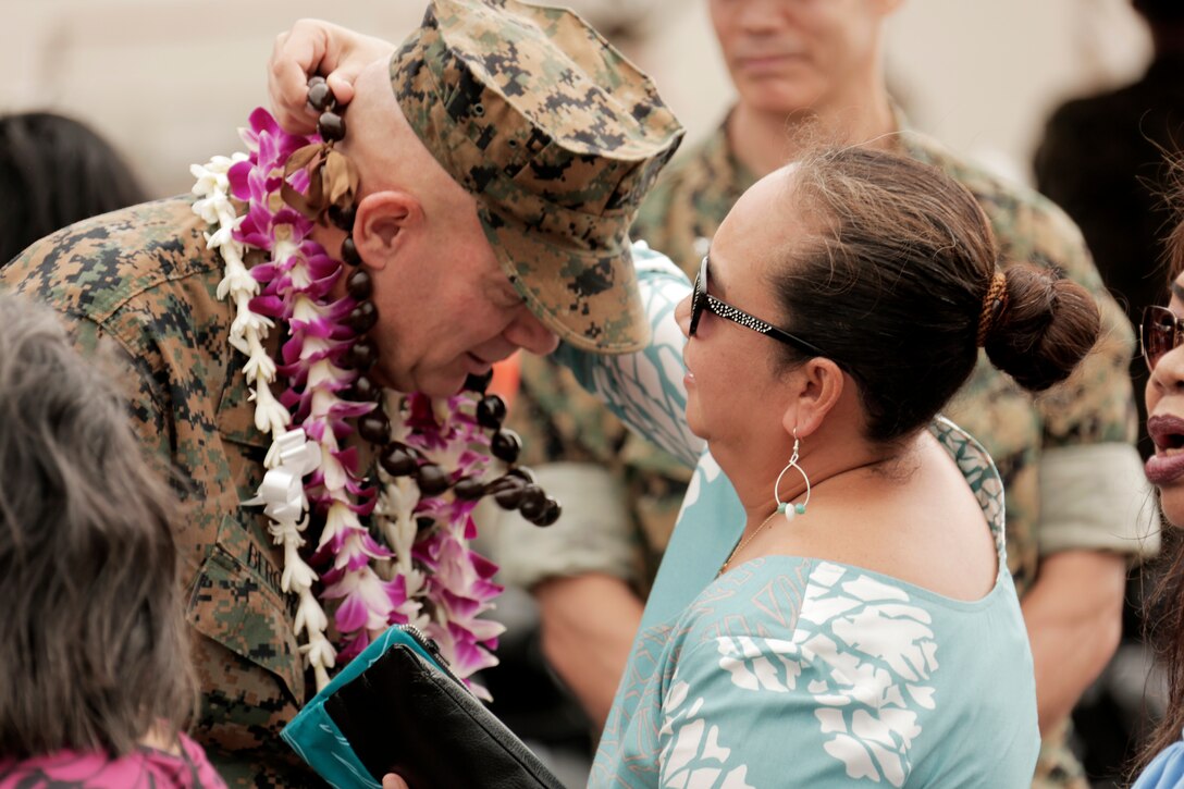 U.S. Marine Corps Lt. Gen. David H. Berger, left, outgoing commander, U.S. Marine Corps Forces, Pacific, is presented a lei after the MARFORPAC change of command ceremony at Marine Corps Base Hawaii, Aug. 8, 2018. The change of command ceremony represents the transfer of responsibility and authority over MARFORPAC between commanders.