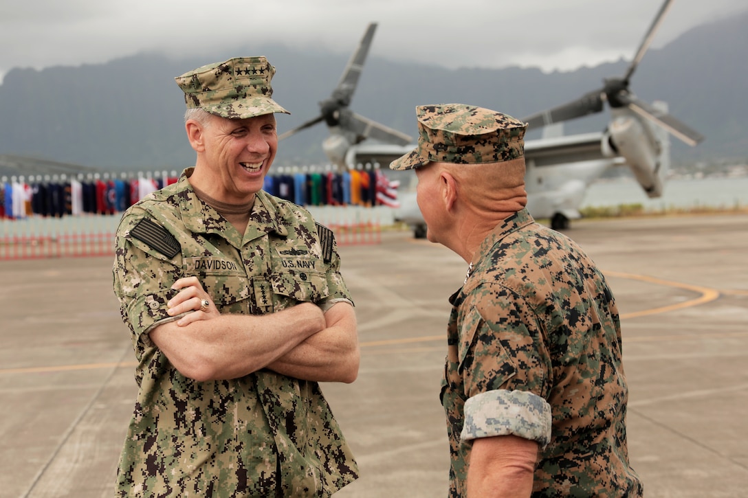 U.S. Navy Adm. Phil Davidson,  left, commander of U.S. Indo-Pacific command, and Commandant of the Marine Corps Gen. Robert B. Neller speak after the MARFORPAC change of command ceremony at Marine Corps Base Hawaii, Aug. 8, 2018. The change of command ceremony represents the transfer of responsibility and authority over MARFORPAC between commanders.
