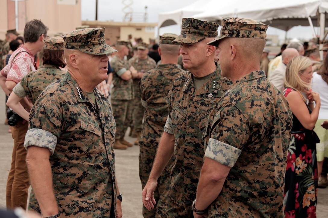 Commandant of the Marine Corps Gen. Robert B. Neller, left, Lt. Gen. David H. Berger, outgoing commander of U.S. Marine Corps Forces, Pacific (MARFORPAC) and Lt. Gen. Lewis A. Craparotta, incoming commander of MARFORPAC, speak before the MARFORPAC change of command ceremony at Marine Corps Base Hawaii, Aug. 8, 2018. The change of command ceremony represents the transfer of responsibility and authority over MARFORPAC between commanders.