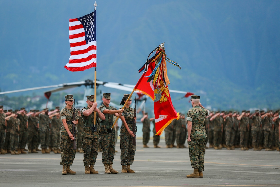 The U.S. Marine Corps Forces, Pacific color guard presents the colors during the National Anthem at the MARFORPAC change of command ceremony at Marine Corps Base Hawaii, Aug. 8, 2018. The change of command ceremony represents the transfer of responsibility and authority over MARFORPAC from outgoing to incoming commanders.