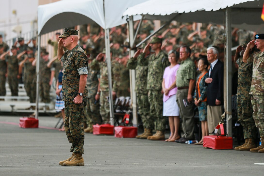 U.S. Marines with U.S. Marine Corps Forces Pacific render honors to Lt. Gen. David H. Berger, outgoing commander, U.S. Marine Corps Forces, Pacific, during the MARFORPAC change of command ceremony at Marine Corps Base Hawaii, Aug. 8, 2018. The change of command ceremony represents the transfer of responsibility and authority over MARFORPAC from outgoing to incoming commanders.