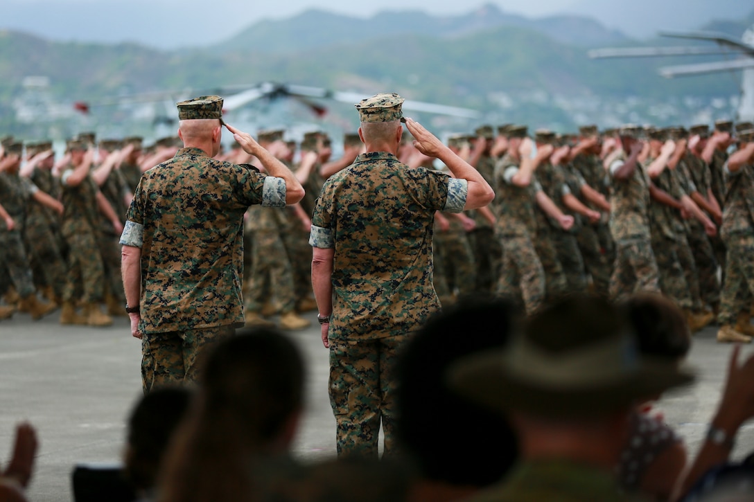 U.S. Marine Corps Lt. Gen. David H. Berger, left, outgoing commander, U.S. Marine Corps Forces, Pacific and Lt. Gen. Lewis A. Craparotta, right, incoming commander, salute during the pass and review at the MARFORPAC change of command ceremony at Marine Corps Base Hawaii, Aug. 8, 2018. The change of command ceremony represents the transfer of responsibility and authority over MARFORPAC from outgoing to incoming commanders.