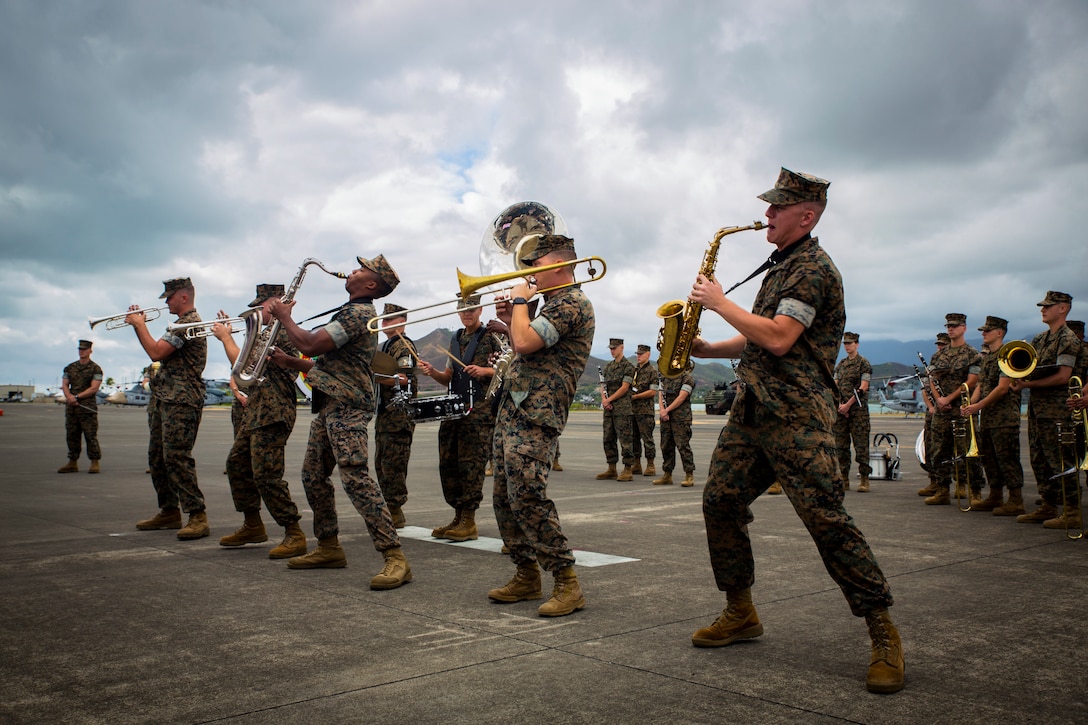 U.S. Marines with the U.S. Marine Corps Forces, Pacific band perform at the MARFORPAC change of command ceremony at Marine Corps Base Hawaii, Aug. 8, 2018. The change of command ceremony represents the transfer or responsibility and authority between commanders.
