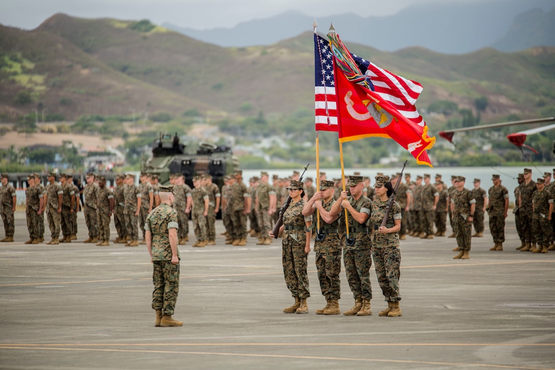 The U.S. Marine Corps Forces, Pacific color guard carries the national colors and the unit colors during the MARFORPAC change of command ceremony at Marine Corps Base Hawaii, Aug. 8, 2018. The change of command ceremony represents the transfer or responsibility and authority between commanders.