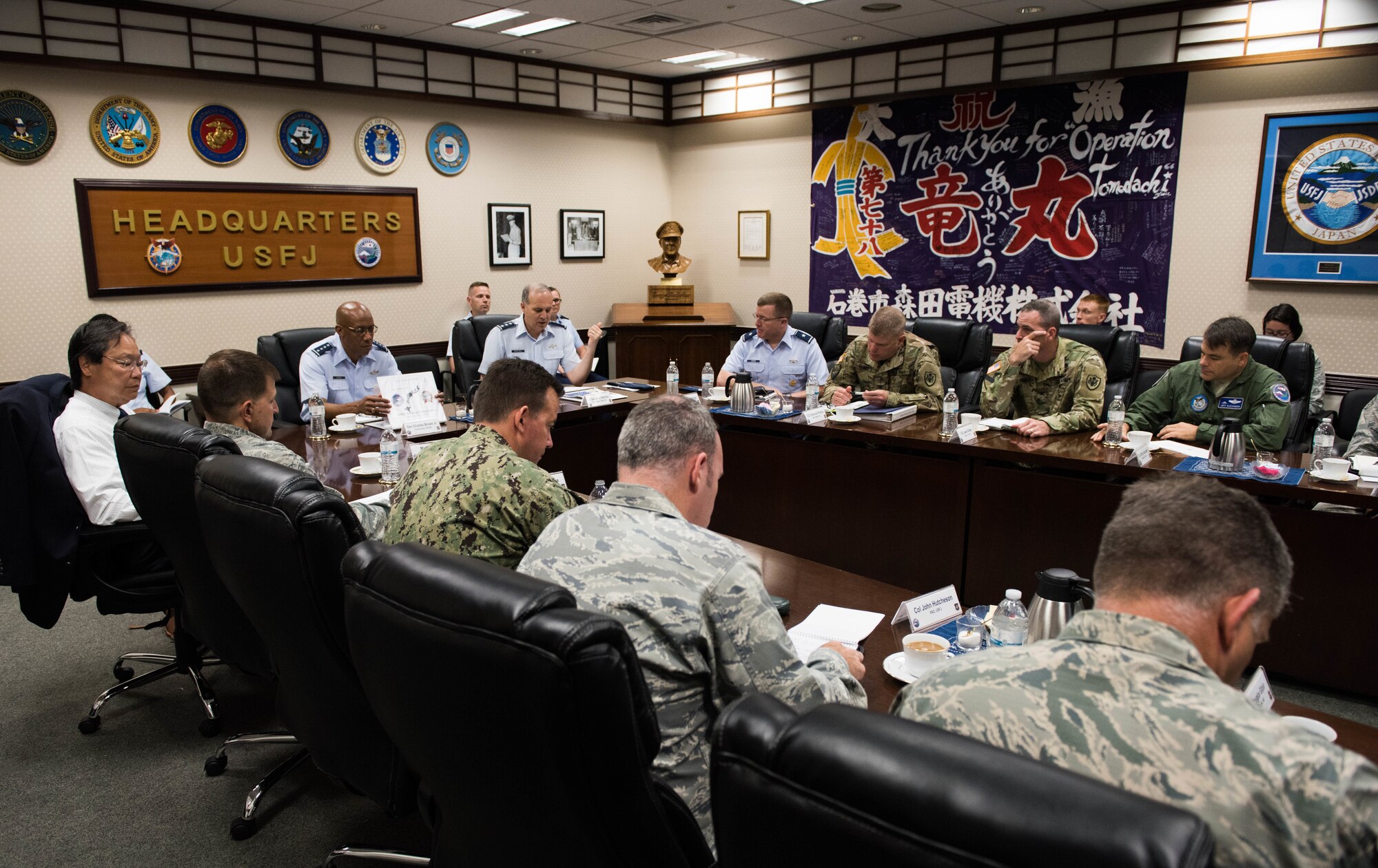 Gen. CQ Brown, Jr., Pacific Air Forces commander, meets with Lt. Gen. Jerry Martinez, U.S. Forces Japan and Fifth Air Force commander, and members of his key staff at Yokota Air Base, Japan, Aug. 6, 2018. Brown met with U.S. and Japanese defense and military leadership as part of his first visit to the region. (U.S. Air Force photo by Staff Sgt. Hailey Haux)