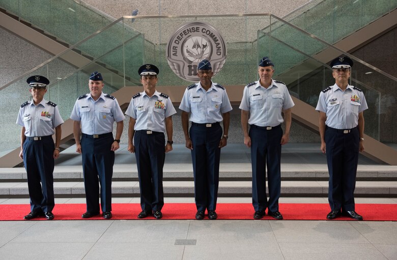 U.S. Air Force from left to right: Brig. Gen. Todd Dozier, Fifth Air Force vice commander, Gen. CQ Brown, Jr.,Pacific Air Forces commander, and Lt. Gen. Jerry Martinez, U.S. Forces Japan and Fifth Air Force commander, pose for a group photo with Lt. Gen. Shigeki Muto (center, left), Japanese Air Defense Command (ADC) commander and members of his staff at ADC headquarters at Yokota Air Base, Japan, Aug. 6, 2018. Brown visited the country to affirm the United States' shared commitment to a free and open Indo-Pacific as well as to seek opportunities to enhance cooperation and coordination across the alliance. (U.S. Air Force photo by Staff Sgt. Hailey Haux)