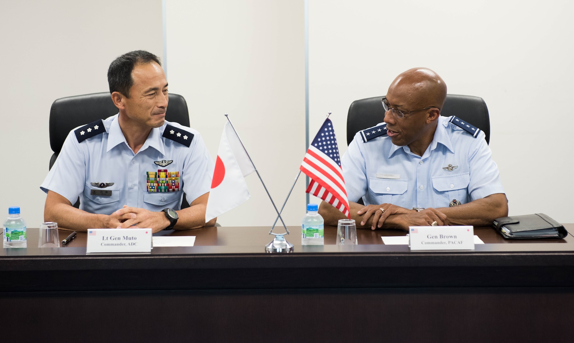 Gen. CQ Brown, Jr., Pacific Air Forces commander, and Lt. Gen. Shigeki Muto, Air Defense Command (ADC) commander, discuss opportunities to enhance cooperation and coordination during his visit to Yokota Air Base, Japan, Aug. 6, 2018. While at the ADC headquarters, the general observed a ballistic missile defense demonstration. (U.S. Air Force photo by Staff Sgt. Hailey Haux)