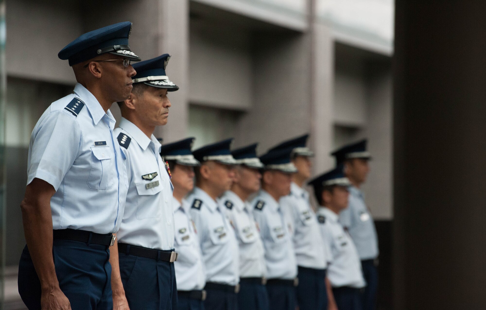 Gen. CQ Brown, Jr., Pacific Air Forces commander, and Gen. Yoshinari Marumo, Chief of Staff, Koku-Jietai (Japan Air Self Defense Force), prepare for an honor guard ceremony at the Ministry of Defense in Tokyo, Japan, Aug. 7, 2018. Brown visited the country to affirm the United States' shared commitment to a free and open Indo-Pacific as well as to seek opportunities to enhance cooperation and coordination across the alliance. For more than 60 years, the U.S.-Japan alliance has been the cornerstone for stability and security in the region. (U.S. Air Force photo by Hailey Haux)